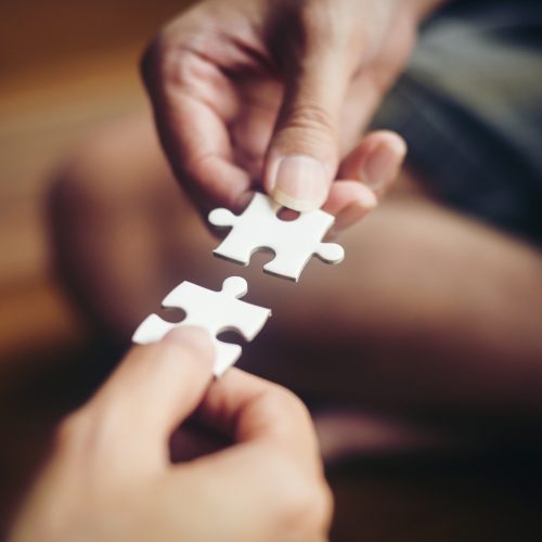 Hand holding jigsaw puzzles, Business partnership concept. Hand holding jigsaw puzzles, Business partnership concept.
