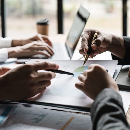 Startup business meeting to analyze and discuss the situation on the financial report in the meeting room. Investment Consultant, Financial advisor and accounting concept. Startup business meeting to analyze and discuss the situation on the financial report in the meeting room. Investment Consultant, Financial advisor and accounting concept