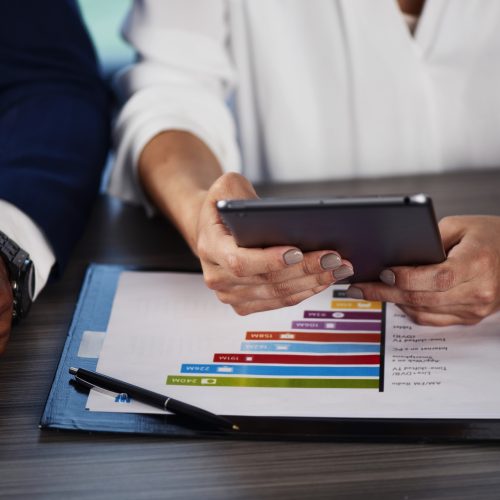 Team of people work together on company statistics in office. concept of teamwork and partnership