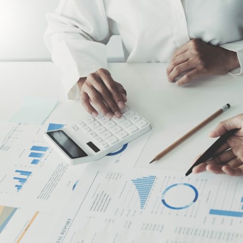 Two executive discussing company growth project success financial statistics, Partner meeting professional investor working start up project for both company with document, laptop and digital tablet. Two executive discussing company growth project success financial statistics, Partner meeting professional investor working start up project for both company with document, laptop and digital tablet..