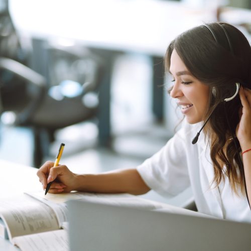 Distance learning. Young business woman, student, teacher. E-learning education concept.