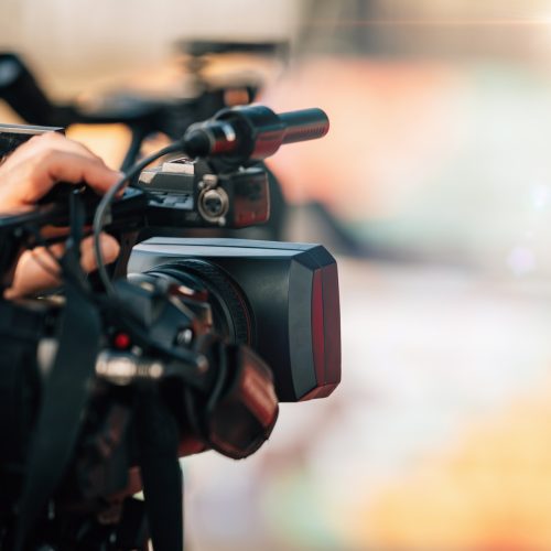 Public Live Event. Television cameras at a press conference outdoors