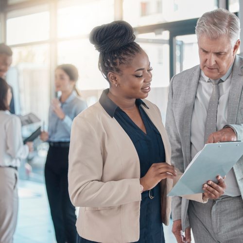 Business people, leadership and clipboard in planning, idea or collaboration for team meeting at th.