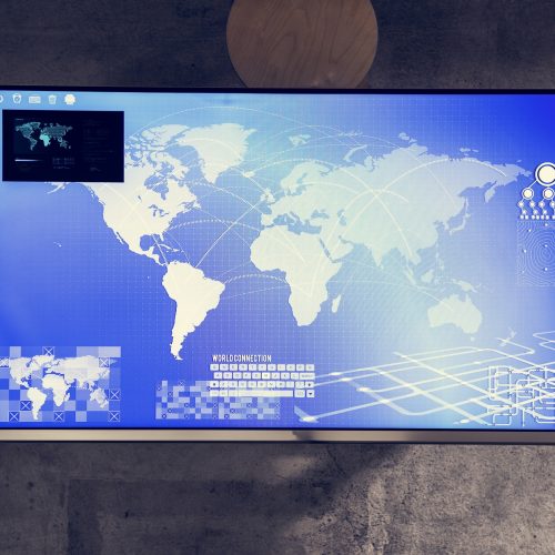 Cyber space table with a world map on screen Cyber space table with a world map on screen