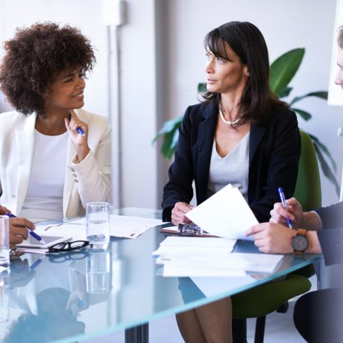 c1-pi-24 Business discussions. Cropped shot of a group of business colleagues meeting in the boardroom