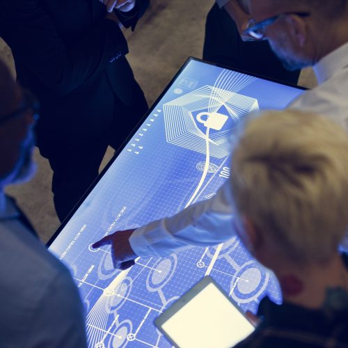 People in a technology cyber space meeting People in a technology cyber space meeting